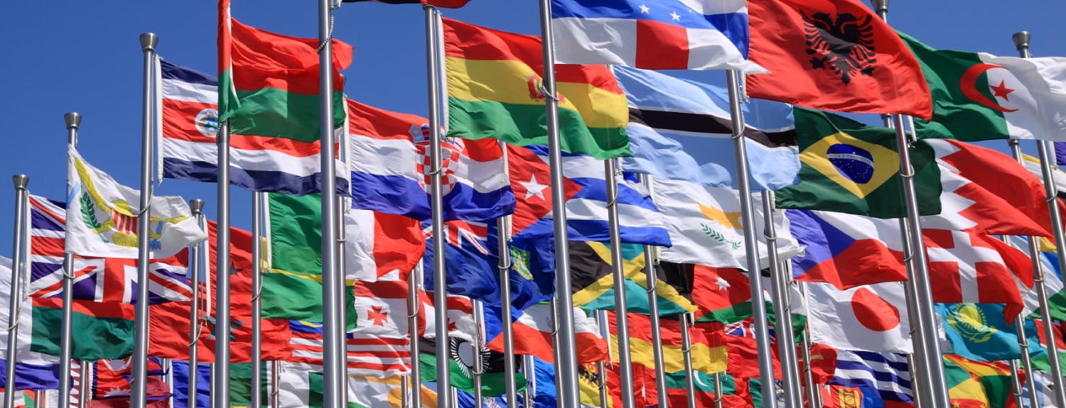 Flags from around the world flapping in the wind
