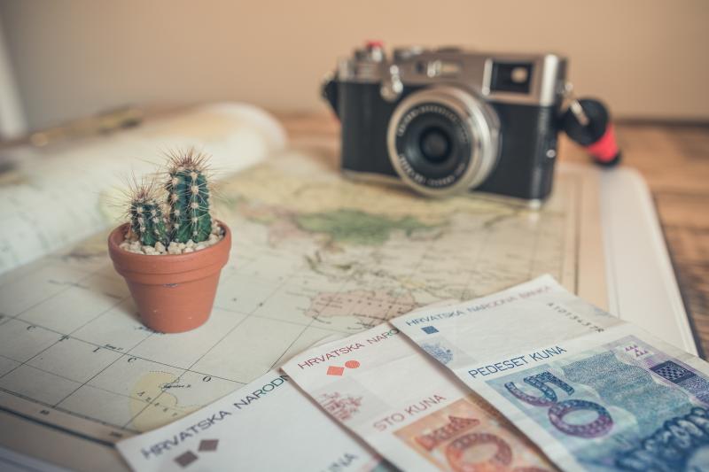 Money, map, and a camera